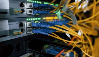 Close up view of internet equipment and cables in the server room.